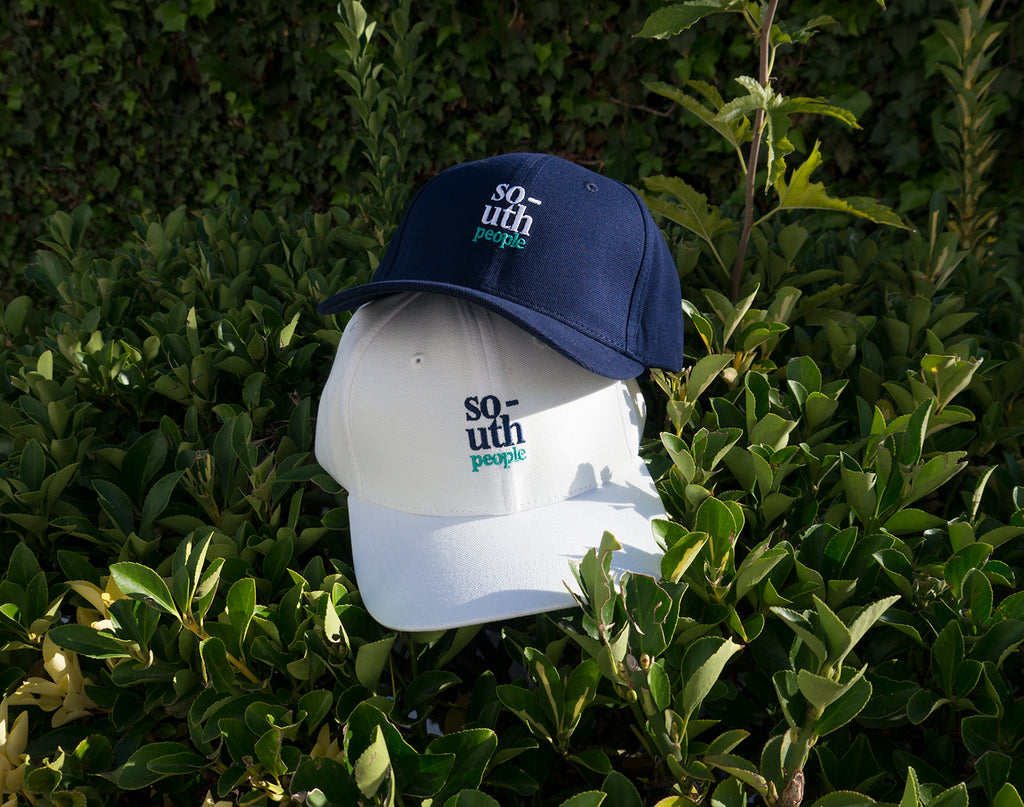 south people cap white and navy blue